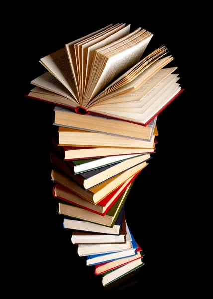 Pile of books on a black background — Stock Photo, Image