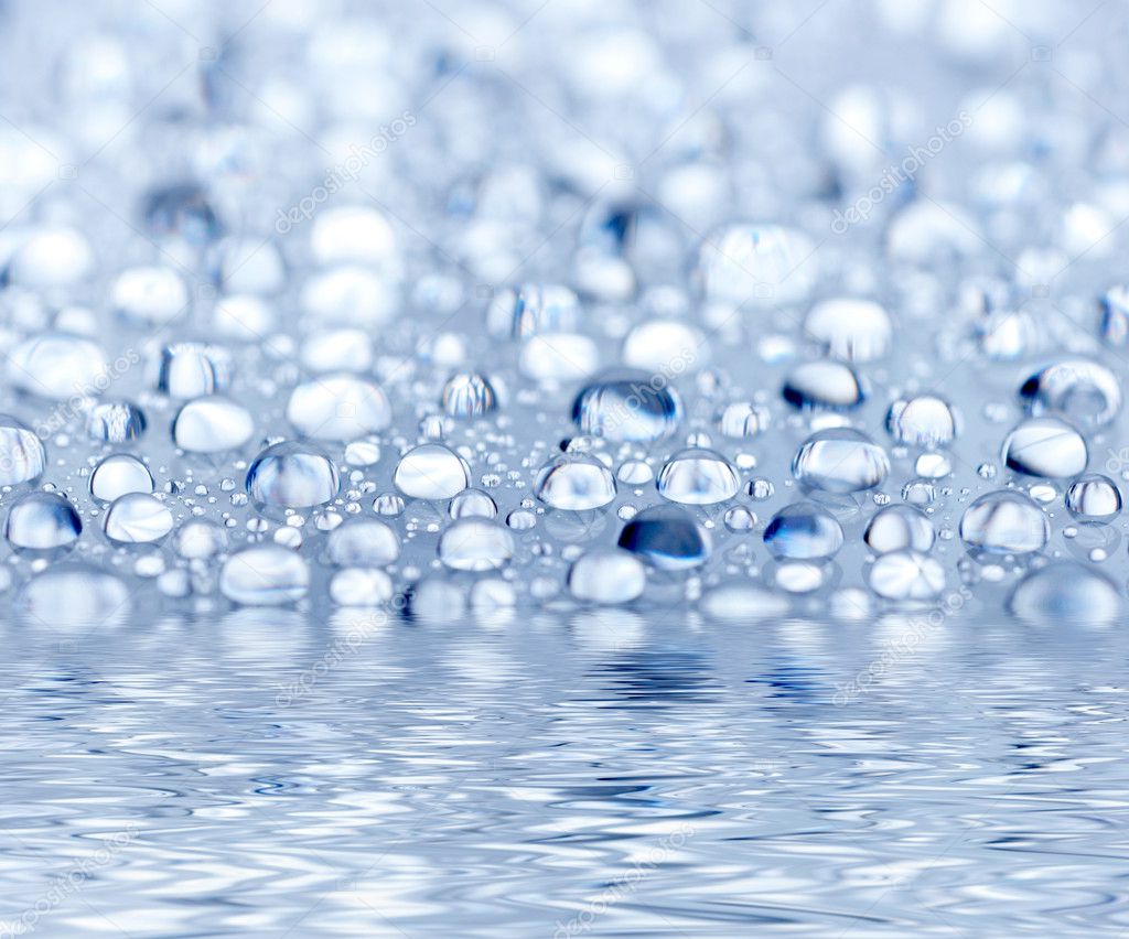 Blue droplets reflected in the water