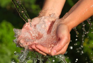 Woman's hands with water splash clipart