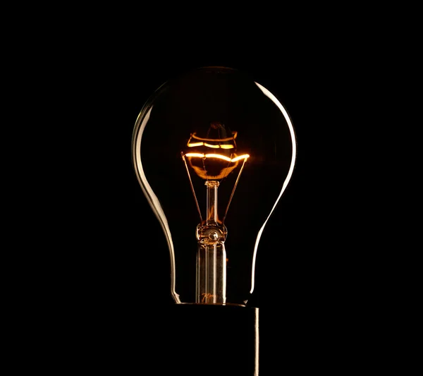 Light bulb over dark background — Stock Photo, Image