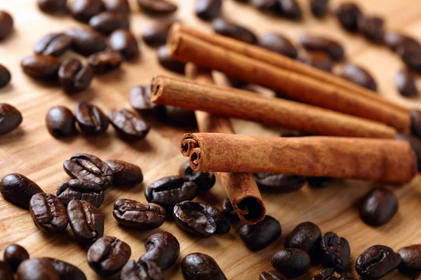 Cinnamon with coffee beans — Stock Photo, Image