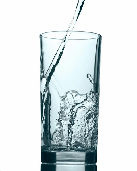 Pouring water into glass isolated on white background — Stock Photo, Image