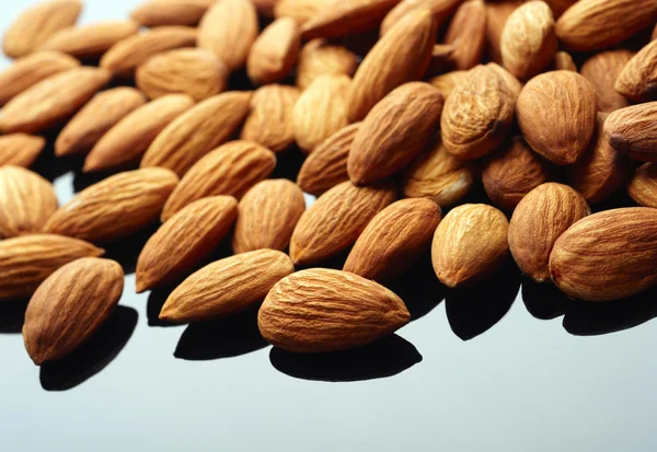 Almonds on black backgrond — Zdjęcie stockowe