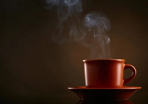 stock image Cup of coffee over dark background