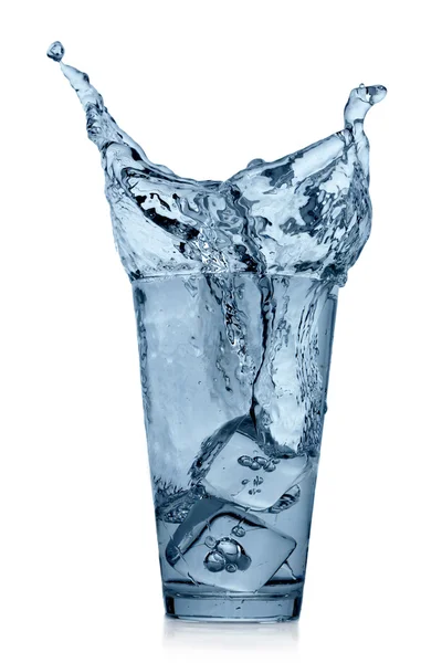 Splashing water in glass — Stok Foto