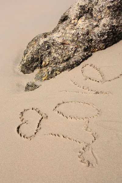 Parola sulla spiaggia di sabbia — Foto Stock