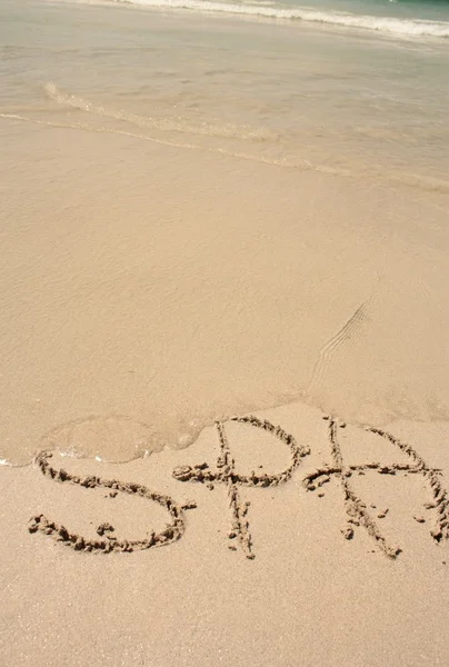 Λέξη στην αμμώδη παραλία — Φωτογραφία Αρχείου