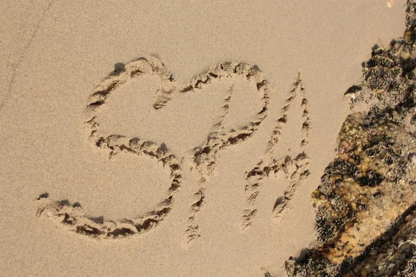 Le mot sur la plage de sable — Photo