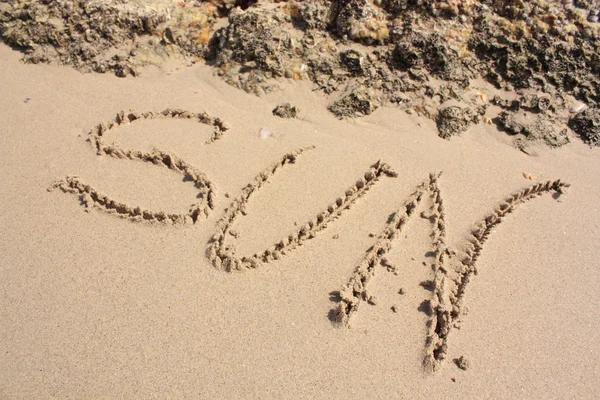 Le mot sur la plage de sable — Photo