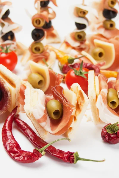 Cold buffet with prosciutto and olives — Stock Photo, Image