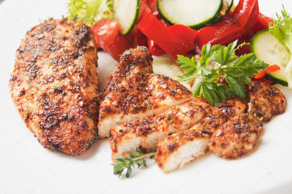 Spicy chicken breasts with vegetable salad