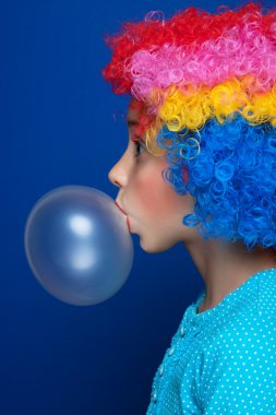 Young girl blowing bubble gum balloon clipart