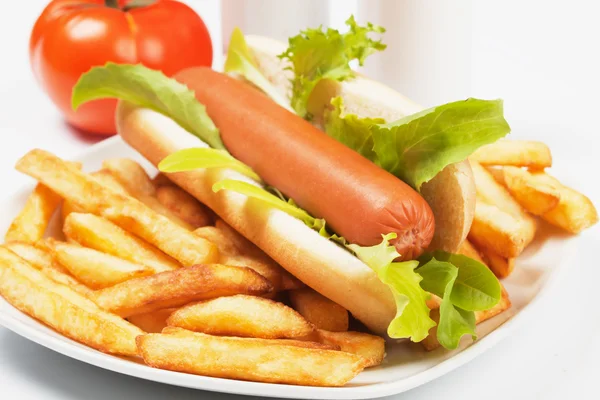 Hot dog with lettuce and french fries — Stock Photo, Image