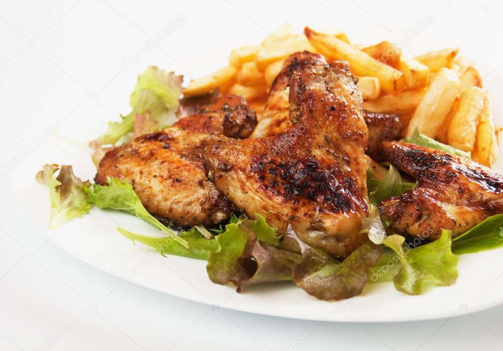 Grilled chicken wings with french fries