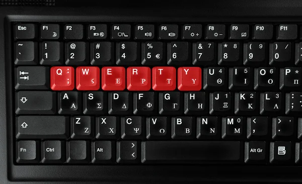 Qwerty letras coloridas em vermelho — Fotografia de Stock