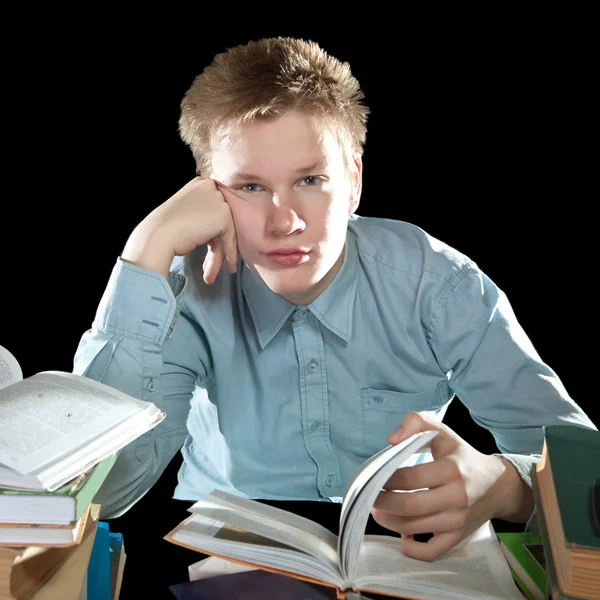 The teenager with a heap of textbooks — Stock Photo, Image