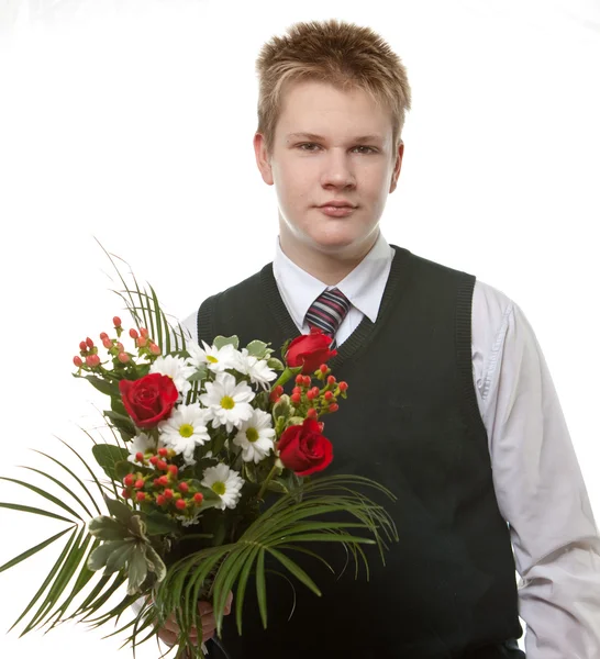 Ученик в школьной форме с букетом цветов — стоковое фото