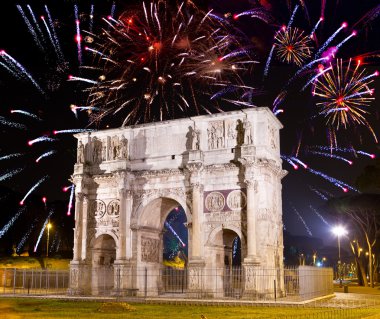 Celebratory fireworks over triumphal arch. Italy. Rome. clipart