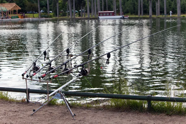 Fishing tackles on the bank of lake — Stock Photo, Image