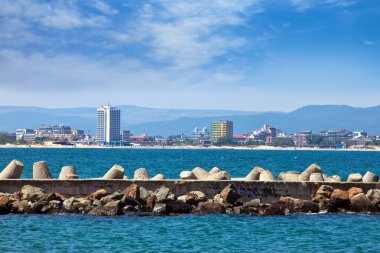 Bulgaria. Nesebr. A view on the modern part of a city and a dam breakwater clipart