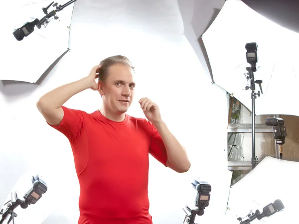 Man poses for the photographer in studio — Stock Photo, Image