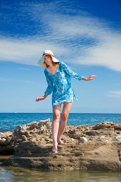 Greece. Rhodes. The young beautiful woman on seacoast. — Stock Photo, Image