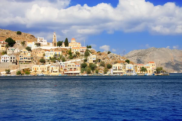 stock image Greece. Dodecanesse. Island Symi (Simi). Colorful houses on rocks.