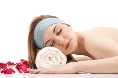 Portrait of beautiful woman relaxing at the spa. clipart