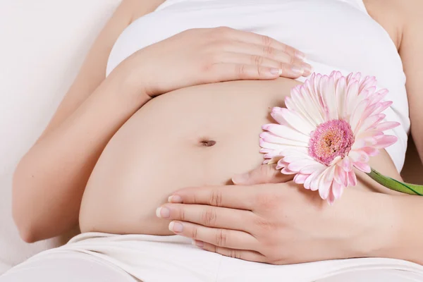 Pregnant woman touching her tummy — Stock Photo, Image
