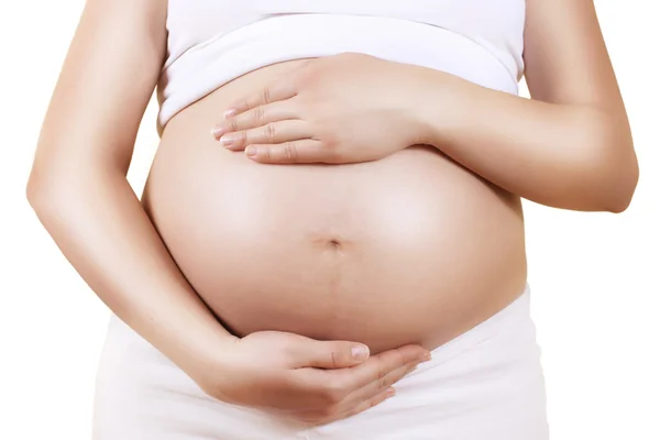 Pregnant woman holding her belly — Stock Photo, Image