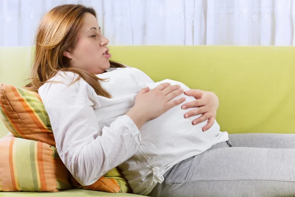 Pregnant woman doing breathing exercises — Stock Photo, Image