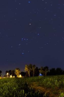 Orion Constellation setting at dusk clipart