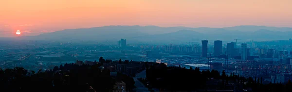 stock image Sunset over Barcelona with Skyscrapers Silhouettes,