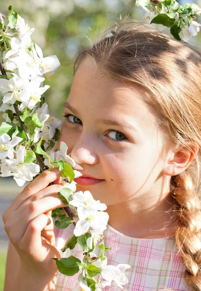 Beautiful blond girl in garden — Stock Photo, Image