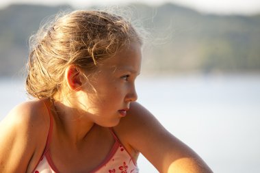 Young girl on the beach clipart