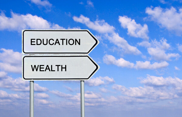 Road sign to eduacation and wealth
