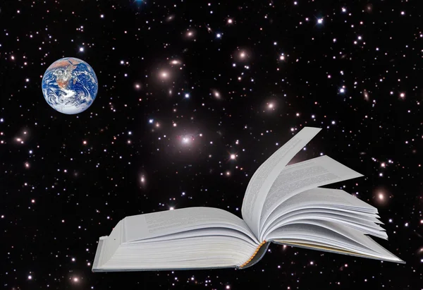 Planet Earth on book.Elements of this image furnished by NASA — Stockfoto