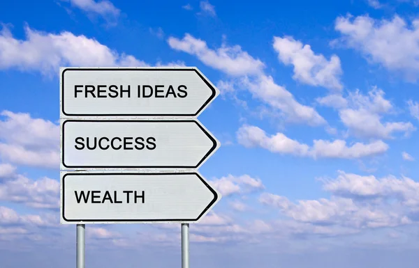 Road sign to fresh ideas,success, wealth — Stock Photo, Image