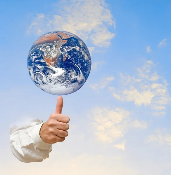 Planet earth on finger.Elements of this image furnished by NASA — Stock Photo, Image