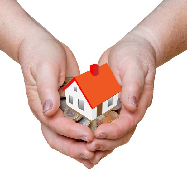 Hands with gift of money and house — Stock Photo, Image