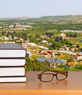 Eyeglasses and books clipart