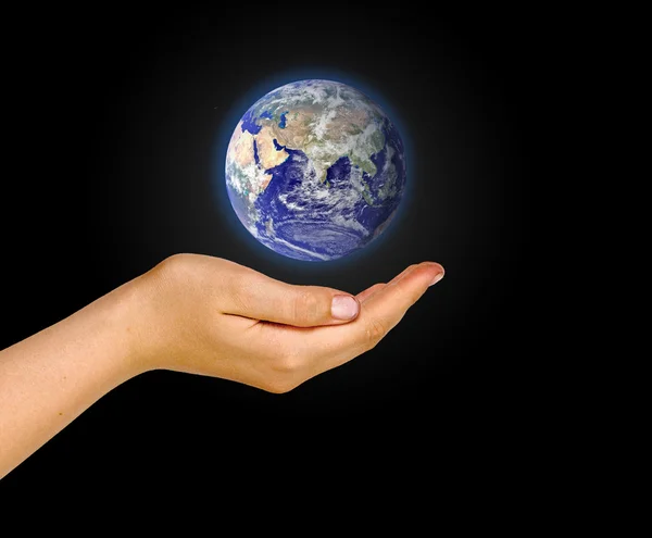 Hand with planet earth Stock Photo