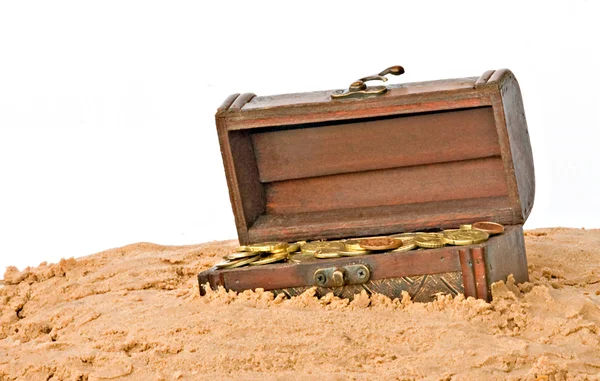 Wooden treasure chest in sand — Stock Photo, Image