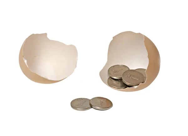 Brązowy jajko z monet — Zdjęcie stockowe