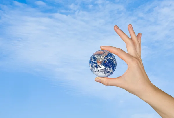 Planet earth in finger.Elements of this image furnished by NASA — Stock Photo, Image
