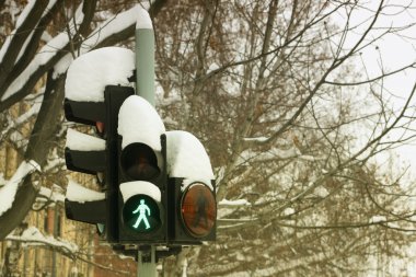 Traffic light under snow clipart