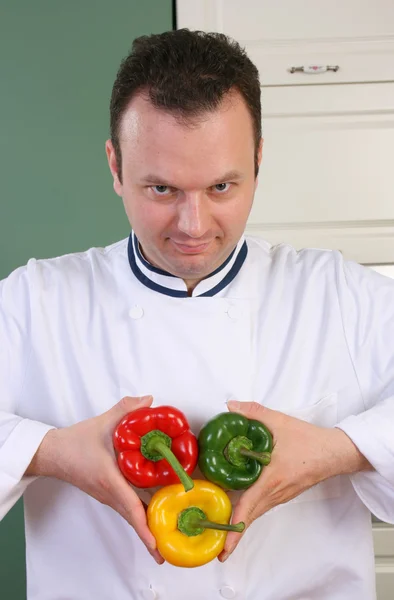 Šéfkuchař a papriky — Stock fotografie