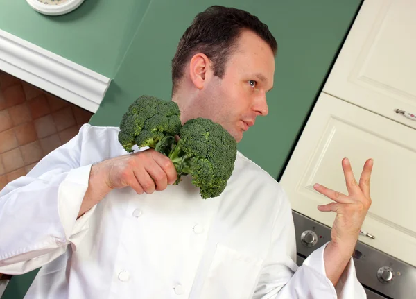 Chef-kok en broccoli — Stockfoto