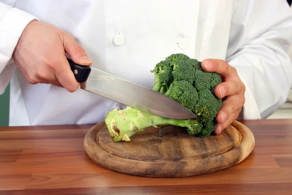 Chef and broccoli — Stock Photo, Image