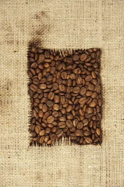 Кофейные зерна и ткани — стоковое фото